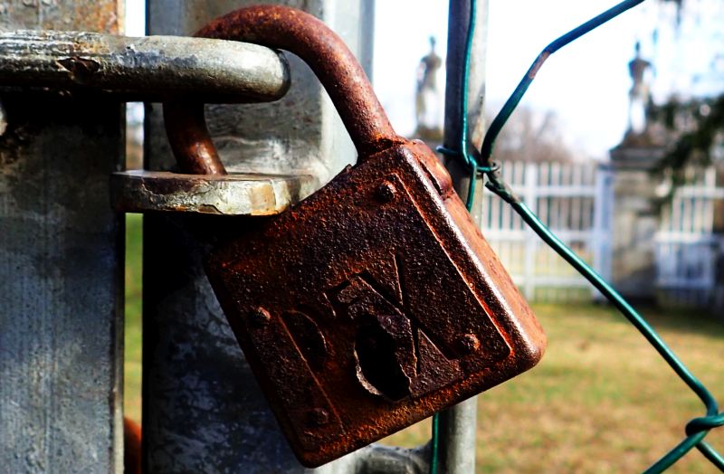 Consulting locks individuals and firms in battles for intellectual acuity, innovation, and talent. (Lock looking into an equestrian arena, Laxenburg, Austria, February 2023).